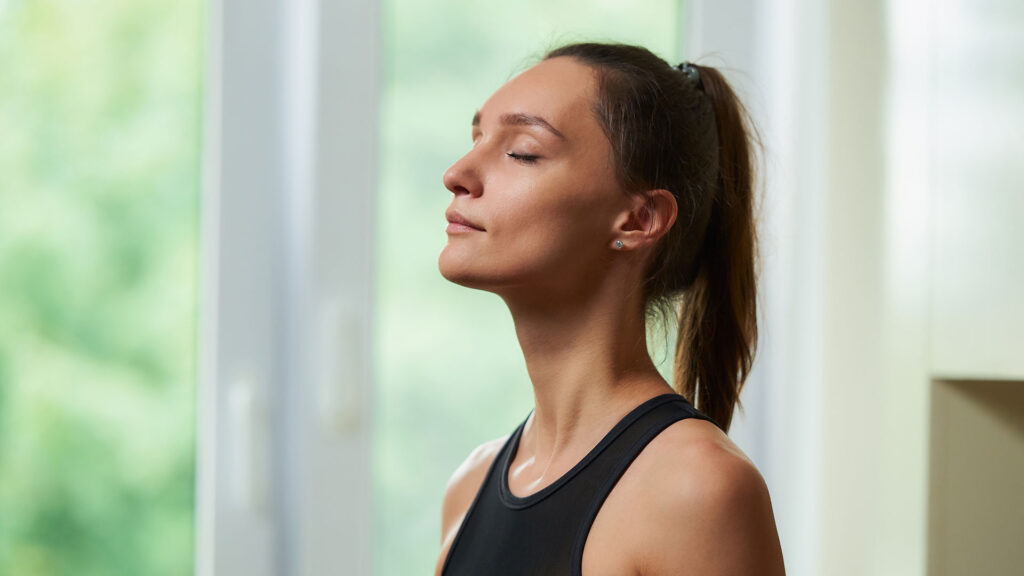 Woman Taking Deep Breath.